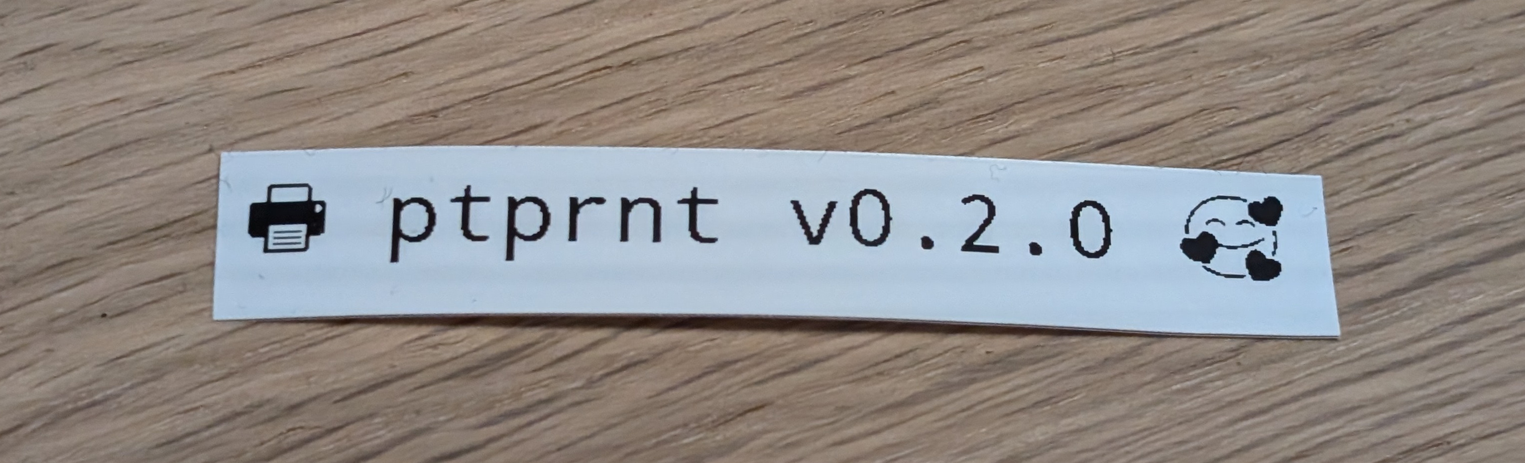 Printed label that proudly reads 🖶 ptprnt v0.2.0 🥰